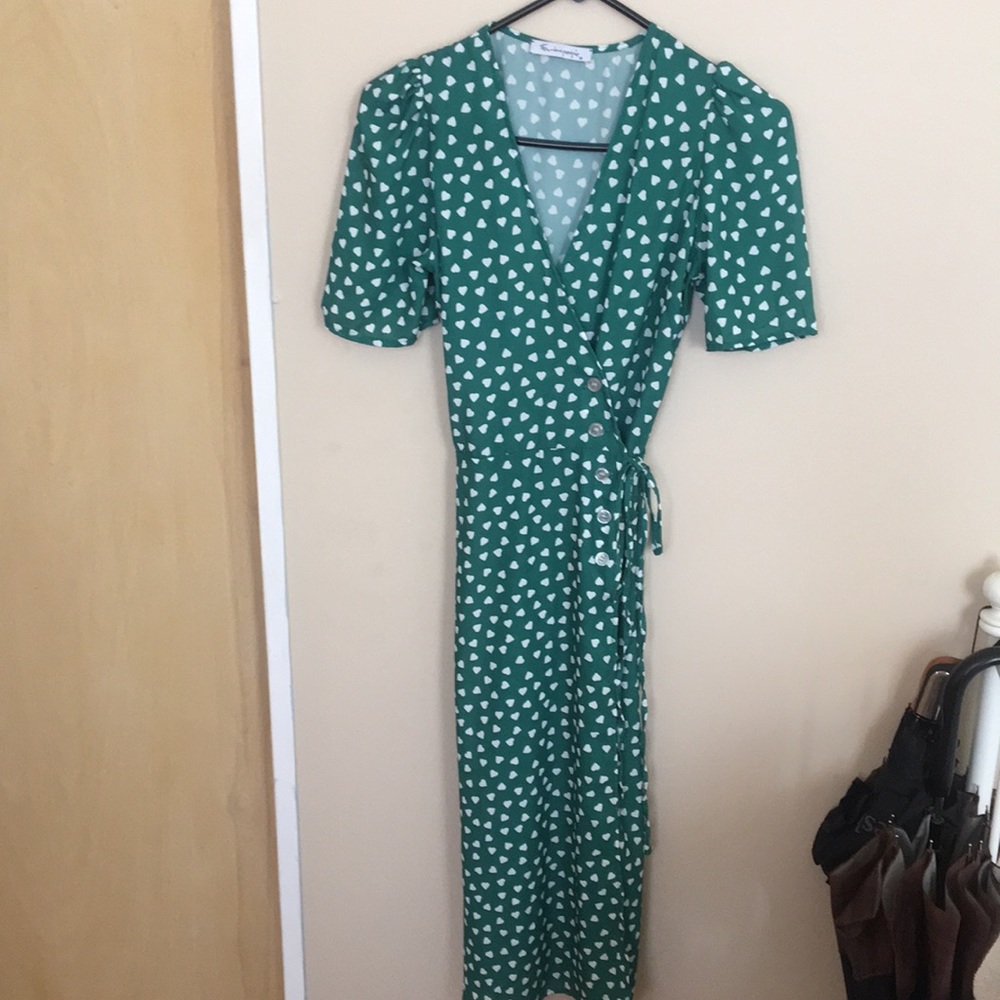 Heart printed green wrap dress.
